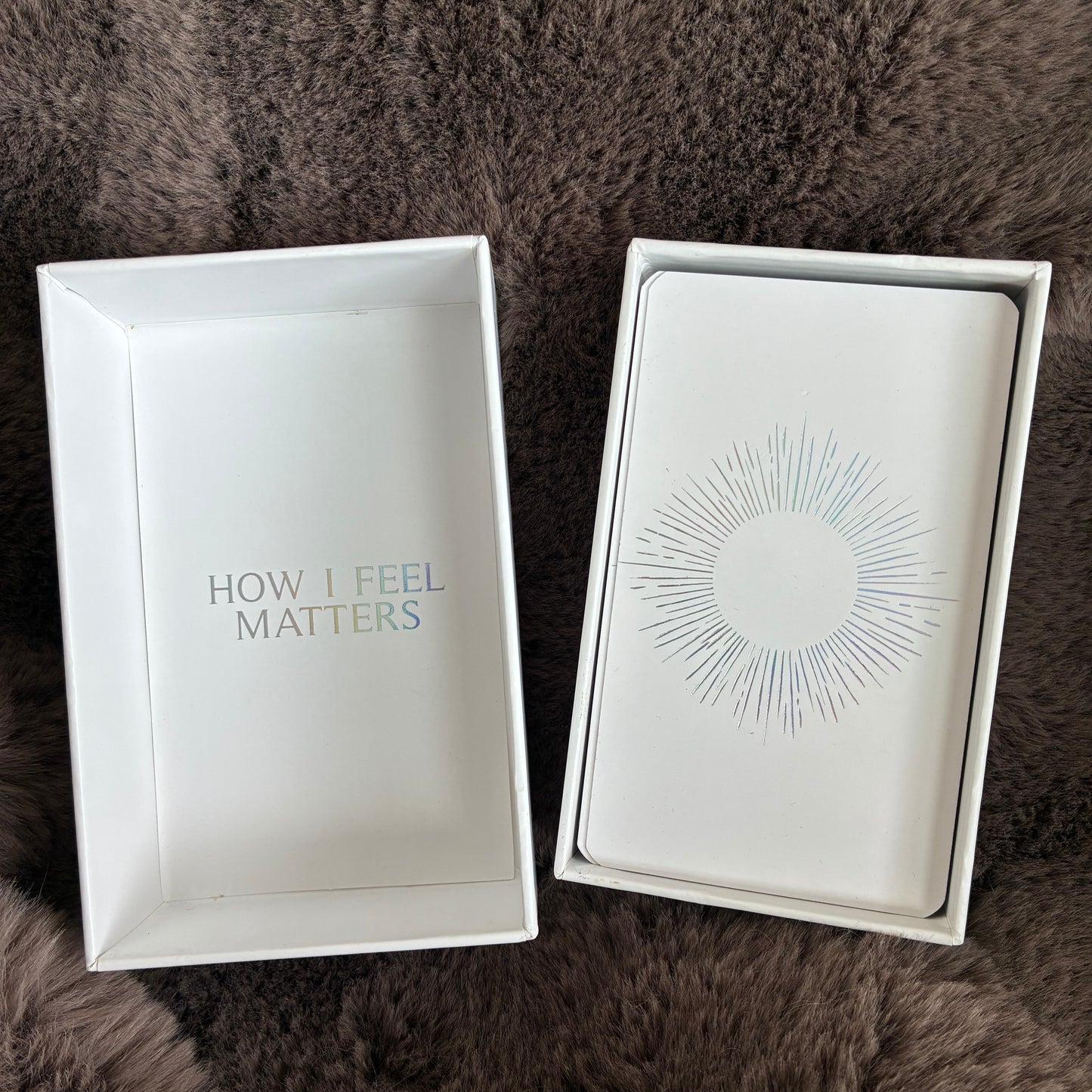 Affirmation card deck UK – open with holographic details, on a fluffy brown blanket