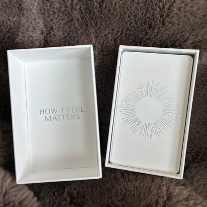 Affirmation card deck UK – open with holographic details, on a fluffy brown blanket